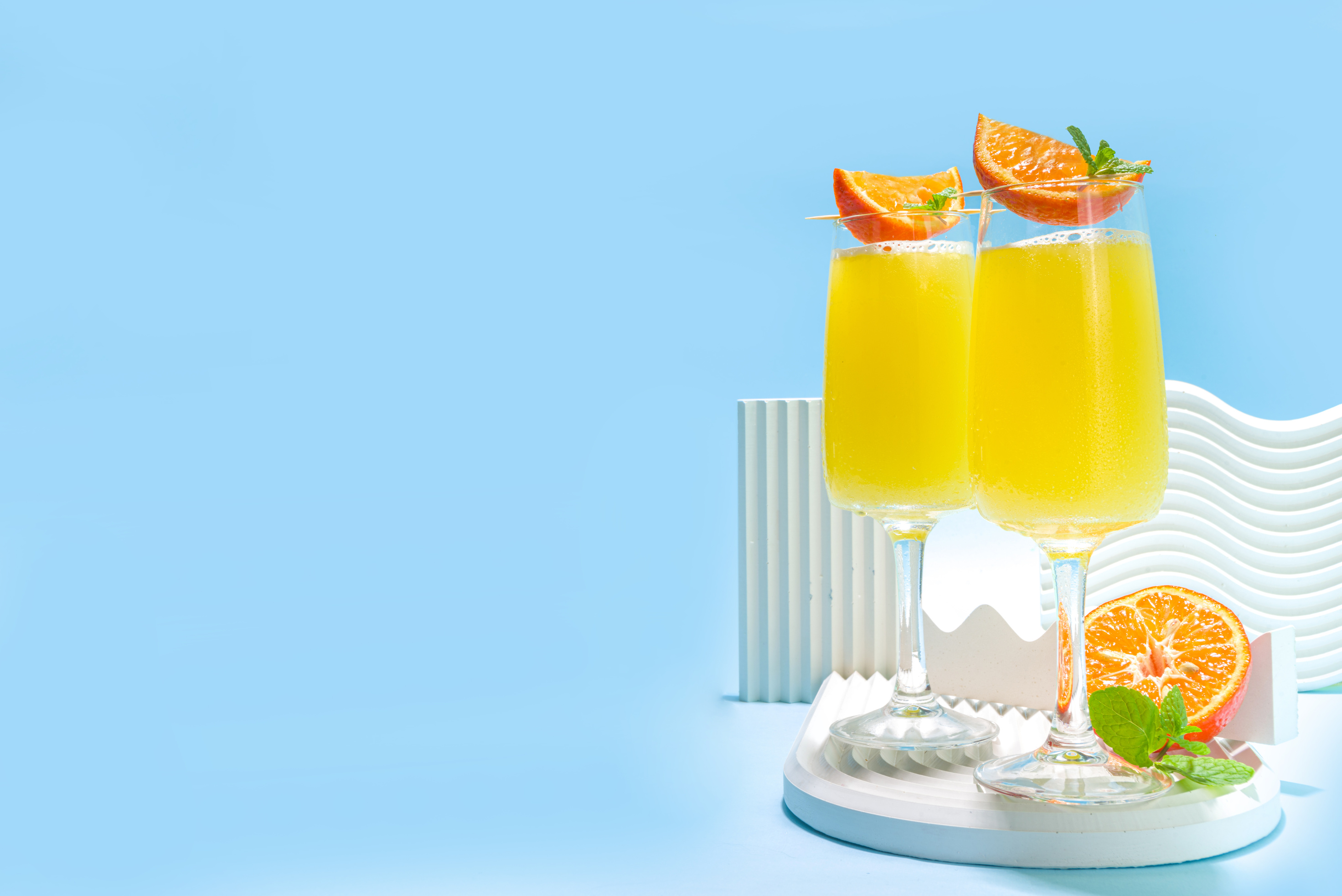 Classic summer mimosas cocktail, with orange juice